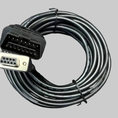 Coiled black diagnostic cable with OBD-II connector on a patterned surface